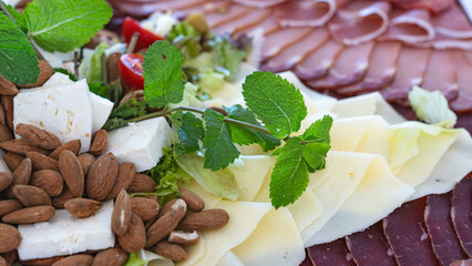 Food buffet with ham, cheese and almonds.  Catering concept. Closeup.