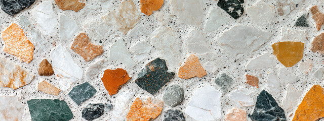 Classic terrazzo texture in light tones with colorful stone chips, modern and stylish