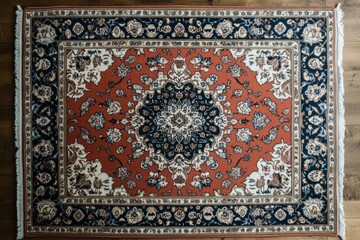 Traditional persian rug with a captivating orange center and dark blue border, showcasing elaborate floral motifs