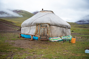 Mongolian local family live in the Ger between mountains and river, trees and lakes