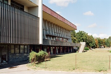 building of Mestske lazne in Chomutov in Czechia on 10. September 2024 on color film - blurriness and noise of scanned 35mm film were intentionally left in image
