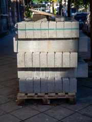 Block with paving stones on the street. Preparation for pavement repair.