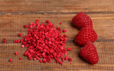 dried raspberries on wooden background