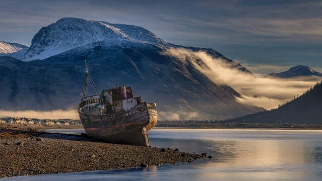 Ben Nevis and the Corpach wreck on a winter morning in the Highlands of Scotland.