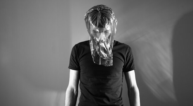 Man with Wrapped in Plastic Wrap