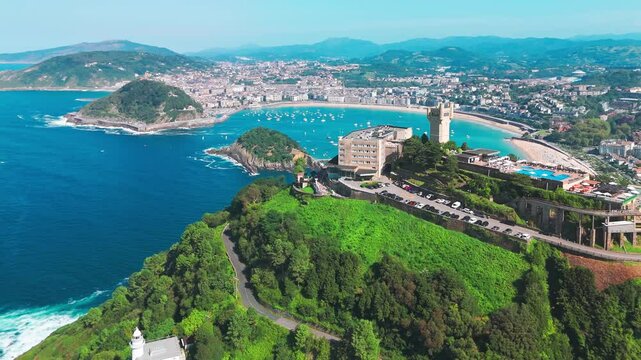 Flying over monte Igueldo Tower in San Sebastian city, Basque country, Spain