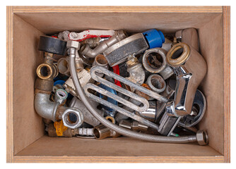 Wooden box with plumbing accessories.