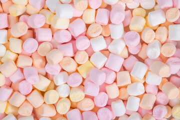 Colorful mini marshmallows background. Sweet marshmallow texture. Top view.