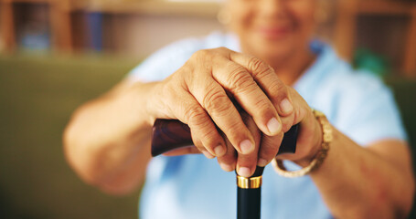 Elderly woman, cane and hands at retirement home for care, support and mobility as pensioner. Senior, female person with a disability and walking stick for arthritis, rehabilitation or injury in zoom