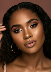  a beautiful black woman with a beautiful makeup look with big full mink eyelashes and neutral colors