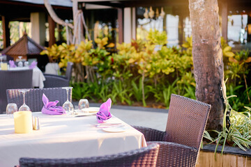 Elegant Beachfront Dining Setup With Purple Napkin