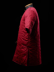 Historical fashion. Medieval knight cloth. Padded jacket gambeson.