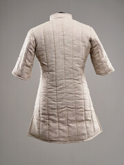 Historical fashion. Medieval knight cloth. Padded jacket gambeson.