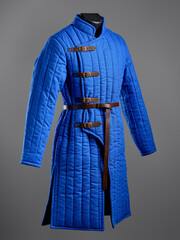 Historical fashion. Medieval knight cloth. Padded jacket gambeson.