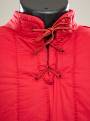 Historical fashion. Medieval knight cloth. Padded jacket gambeson.