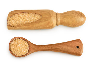 The brown sugar in wooden scoop isolated on white background. Top view. Flat lay