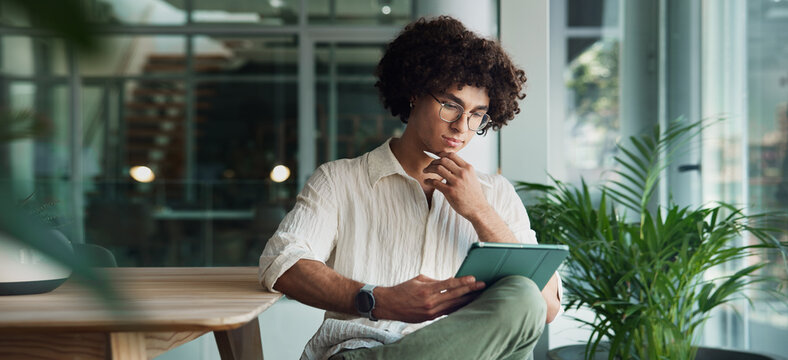 Office, tablet and creative man online for social media, research project and email on internet. App designer, thinking and person on digital tech for networking, business connection and contact