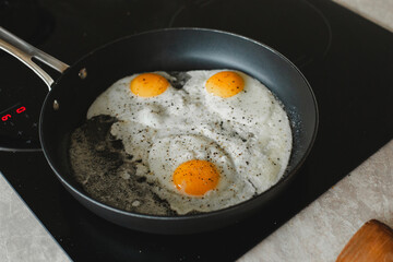 Fresh eggs sizzling in the pan — a delicious start to the day, filled with aroma and energy