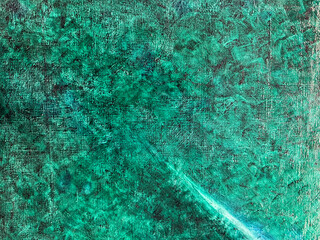 Unique textured green surface with swirls creating a captivating visual interest
