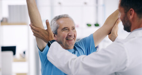 Fototapeta premium Happy man, elderly patient and stretching with physiotherapist for physical examination, checkup or visit at clinic. Male person, medical worker or client with smile for physiotherapy at hospital