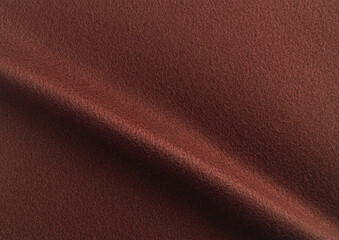 Fototapeta premium Designer paper background with a rich, velvety matte texture in warm earthy tones like terracotta, ochre, and cinnamon. This soft, gradient surface has a chic, vintage appeal with