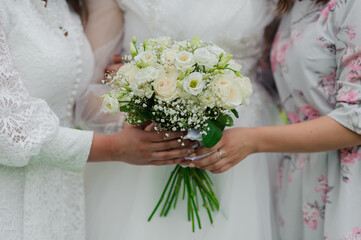 Elegant Bridal Bouquet Surrounded by Loving Friends