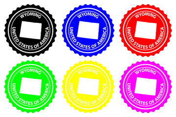 Fototapeta premium Wyoming - rubber stamp - vector, Wyoming (United States of America) map pattern - sticker - black, blue, green, yellow, purple and red