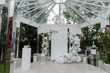 Elegant Outdoor Wedding Reception under a Glass Pavilion