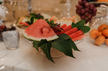 Freshly Sliced Watermelon and Assorted Fruits on Elegant Table Display