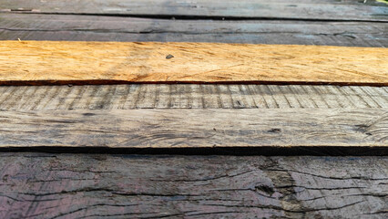 Close-up of weathered wood planks. Close-ups of dark and light colored wood planks show the rich texture and natural pattern of aged wood.