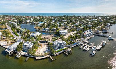 Expensive residential houses in island small town Boca Grande on Gasparilla Island in southwest Florida. American dream homes as example of real estate development in US suburbs