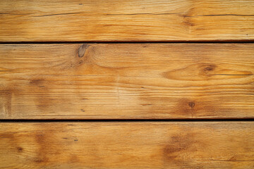 Fototapeta premium Warm-toned wooden planks with rustic texture and visible grain patterns creating a cozy natural aesthetic 