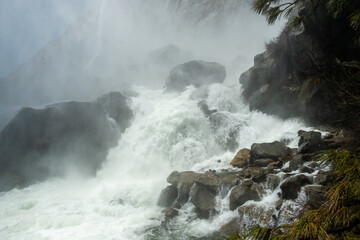 Water Crashing Over the Rocks at the Base of Teeuaualala Falls