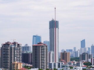Naklejka premium Aerial view of a modern apartment building under construction in a bustling urban area, housing, skyscraper, apartments