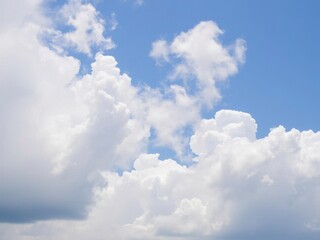 Obraz premium Beautiful white fluffy clouds in a clear blue summer sky, serene, natural, weather