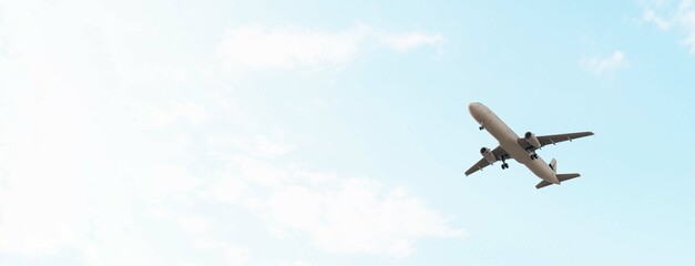 ULTRA HD. Airplane flies in blue sky. Travel, tourism. Airplane takes off against the background of blue sky.  