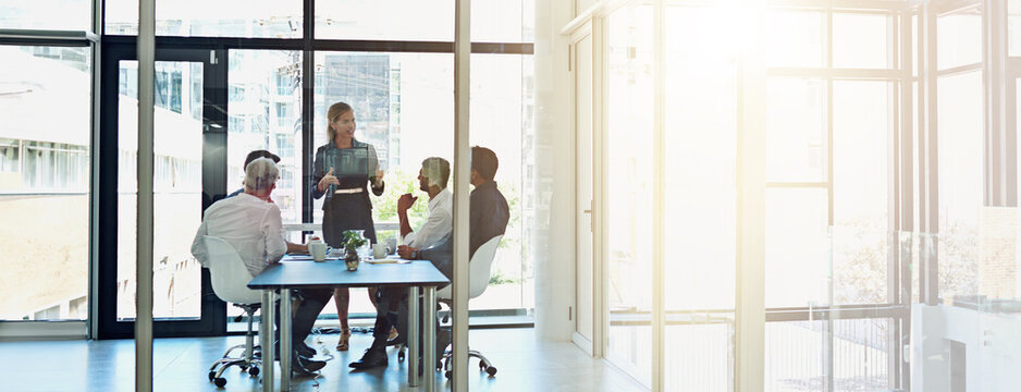Office, business people and woman with discussion in meeting, presentation and project review by flare. Teamwork, employees and manager with planning for corporate company, training and banner space