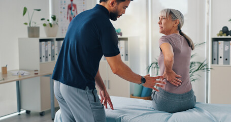 Back pain, physiotherapy and advice with old woman in clinic for healthcare, osteoarthritis or...