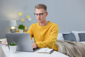 Student preparing for exam at table indoors