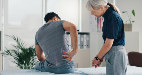 Back pain, physical therapy and patient at consultation for problem, inflammation or muscle strain....