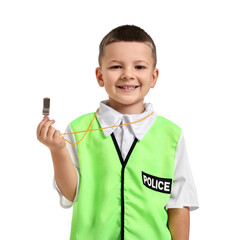Little boy with whistle pretending to be policeman on white background. Dreaming of future...
