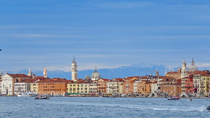 view of venice from the lagoon piazza san marco venice with italy flag vaporetto