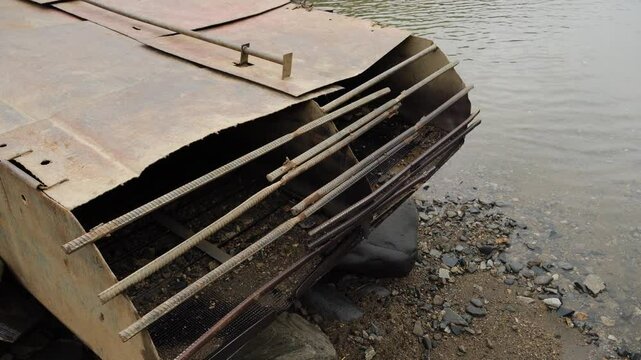 Placer gold mining in Russia. Ecological disaster. Dredge for processing soil and searching for gold.