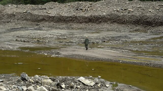 August 15, 2020 - Amur Region, Russia - Placer gold mining in Russia. Environmental disaster. An inspector checks the legality of placer gold mining. Environmental prosecutor's office during the inspe