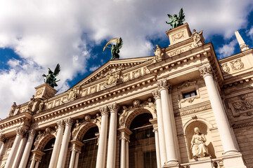 The building is very tall and has a lot of statues on it