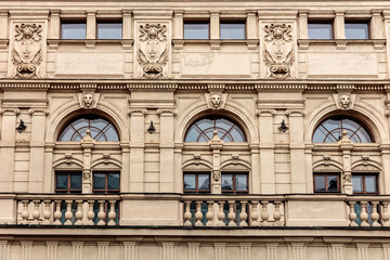 The building has a lot of windows and a balcony