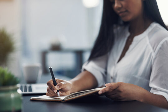 Hands, woman and writing on notebook in office for administration, schedule planner and notes reminder. Female person, journal and agenda with information, ideas report and to do list for proposal - Powered by Adobe