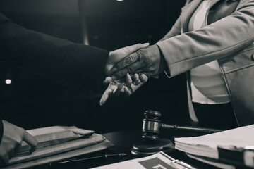 Judge gavel with Justice lawyers having team meeting at law firm background. Concepts of Law and...