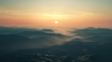 Fototapeta premium Serene Sunrise Over Misty Mountains: A Breathtaking Panorama
