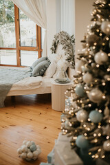 Christmas decorations lights. Modern New Year's decor. Christmas trees with garlands and gifts.